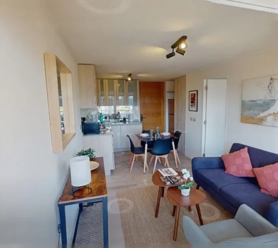 Living comedor y entrada departamento venta con bono pie.