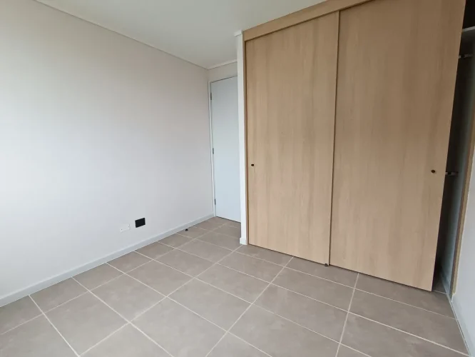 Dormitorio principalm cama 2 plazas departamento cocina costado venta con bono pie San Joaquin