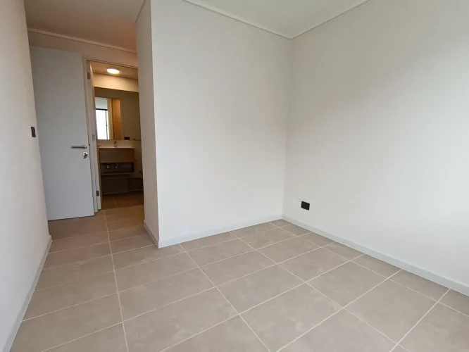 Entarda dormitorio principal departamento cocina costado venta con bono pie San Joaquin