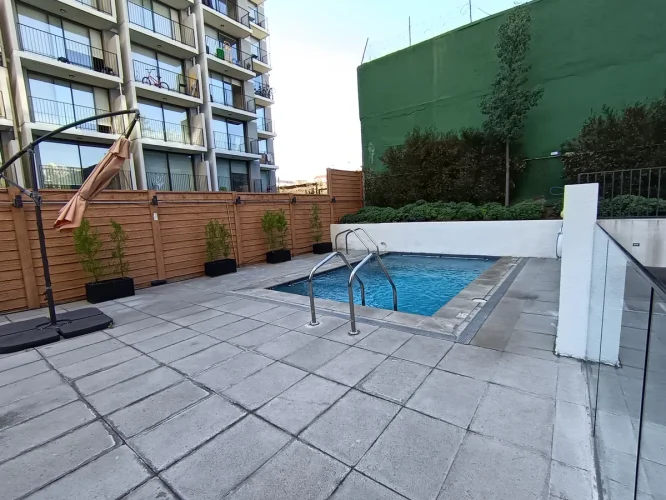 Piscina departamento en venta en Ñuñoa con bono pie entrega inmediata